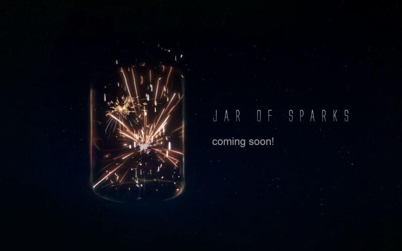 Jar of Sparks logo, an actual jar with sparks on a black background