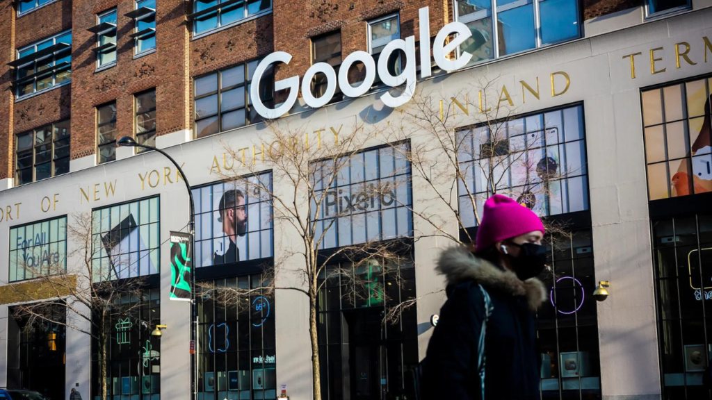 Woman walking in front of a building with a Google sign