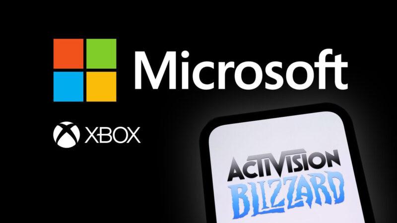 Microsoft and Xbox logos on a black background, while a phone with Activision Blizzard logo is being held