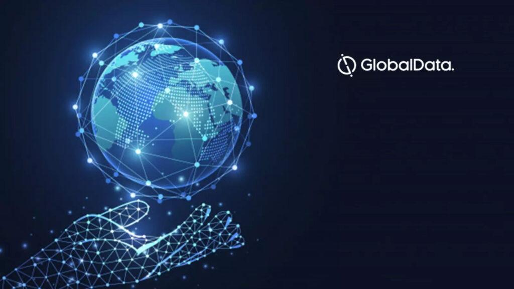A virtual hand holding a virtual world next to GlobalData logo