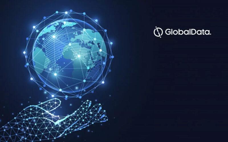 A virtual hand holding a virtual world next to GlobalData logo