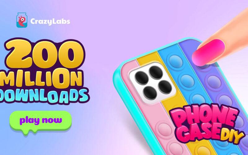 A finger with painted nail is coloring a mobile phone case