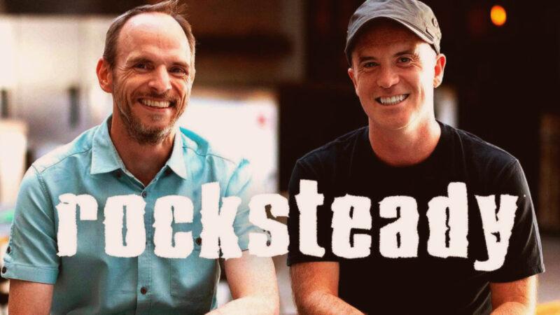 Rocksteady Studios logo over a photo of Sefton Hill and Jamie Walker smiling