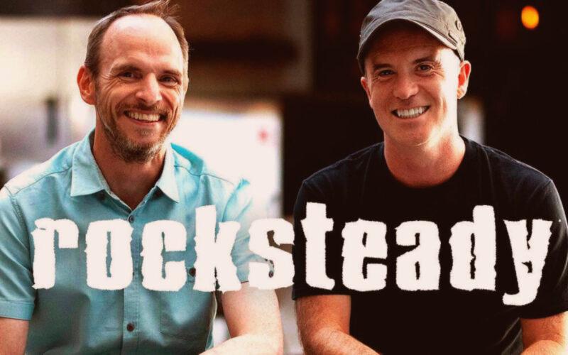 Rocksteady Studios logo over a photo of Sefton Hill and Jamie Walker smiling