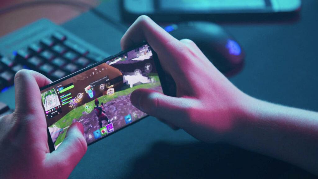 Someone playing a mobile game on their phone