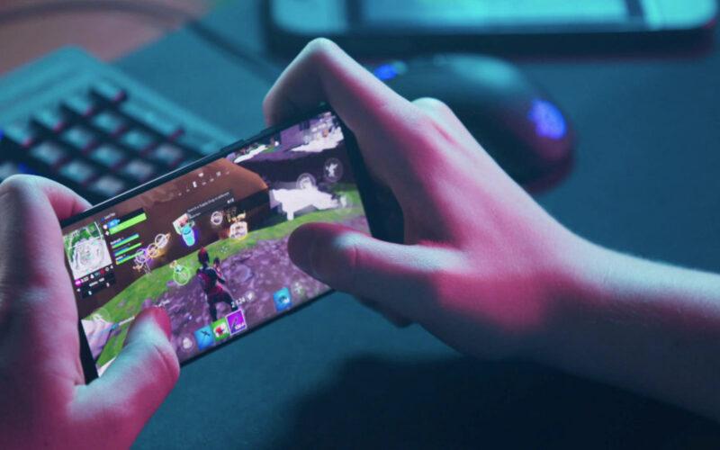 Someone playing a mobile game on their phone