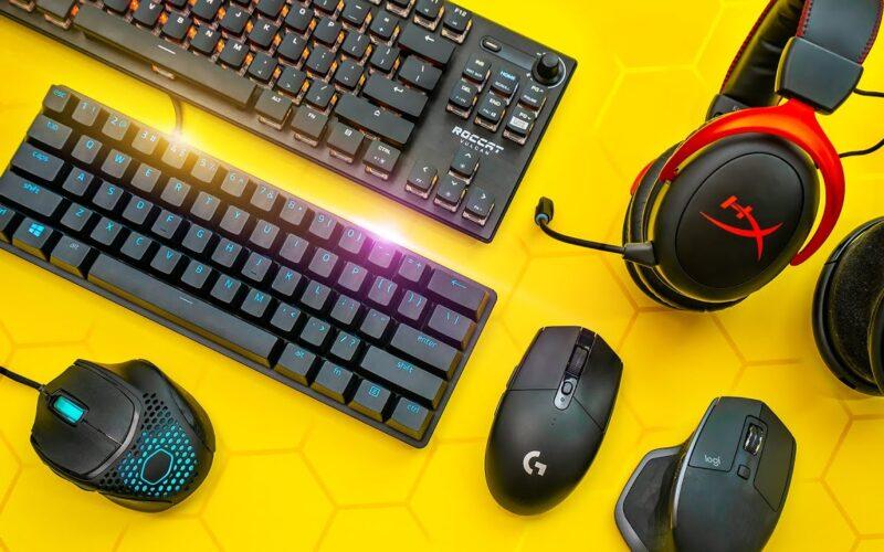 Three computer mice, two keyboards and two headsets on a table