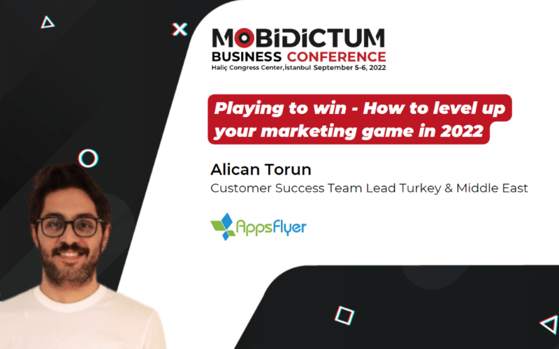 A photo of Alican Torun smiling with the MBC banner in the backgorund