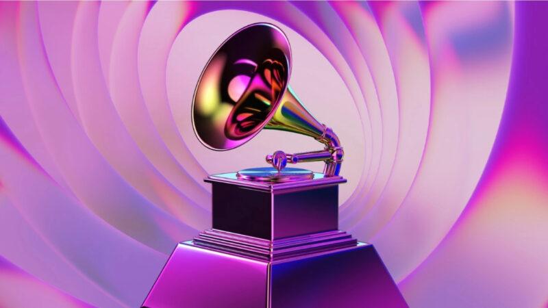 A golden gramophone over a pink-purple background