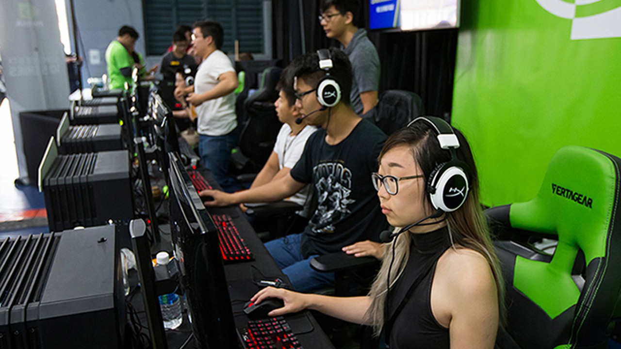young chinese people playing video games