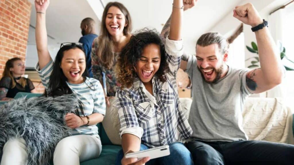 crowd of people playing mobile game in joy