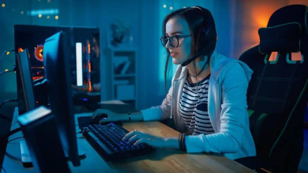 female gamer playing video games with a pc