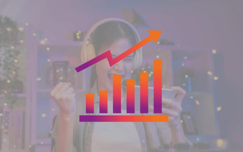 increasing trend graph over the photo of a mobile gamer.