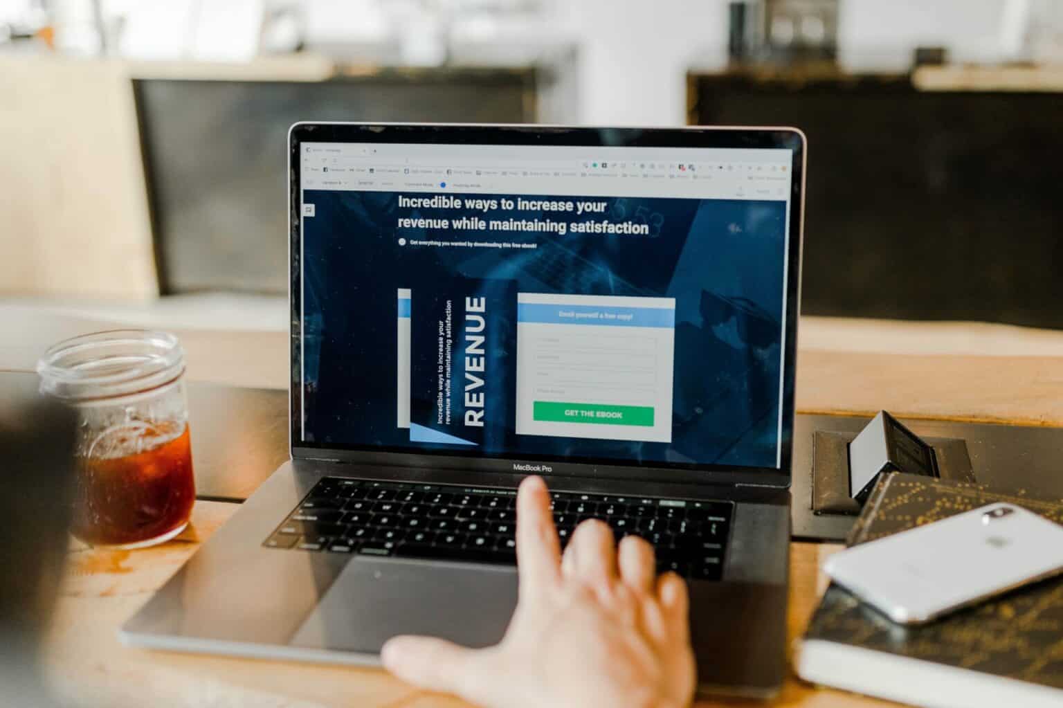 man looking for incredible ways to increase revenue on laptop