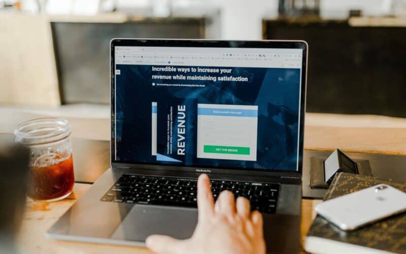 man looking for incredible ways to increase revenue on laptop