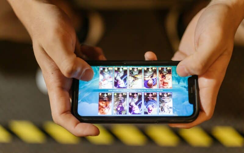 man playing a mobile game
