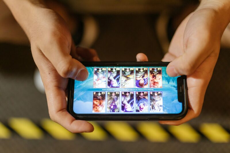 man playing a mobile game