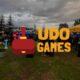 udo games onuncu yıl etkinliğinden bir karenin önünde udo games logosu.