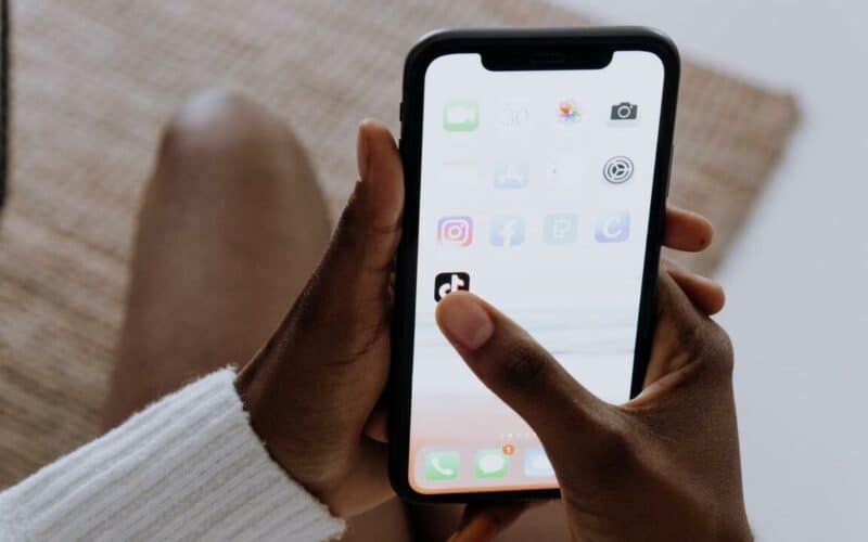 phone with apps on the screen facebook twitter tiktok instagram