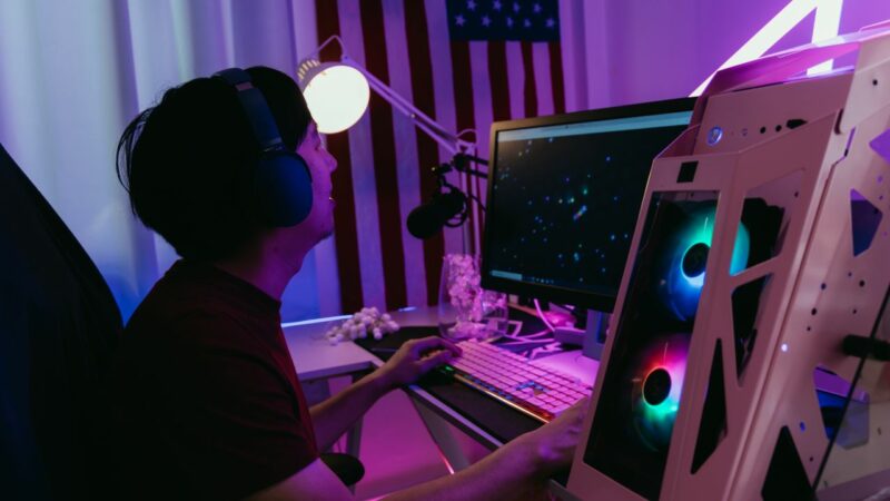 The cover image for the article "How much money do gaming Twitch streamers make?" which includes a gamer before a PC streaming a game.