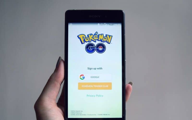phone with the game pokemon go on the screen