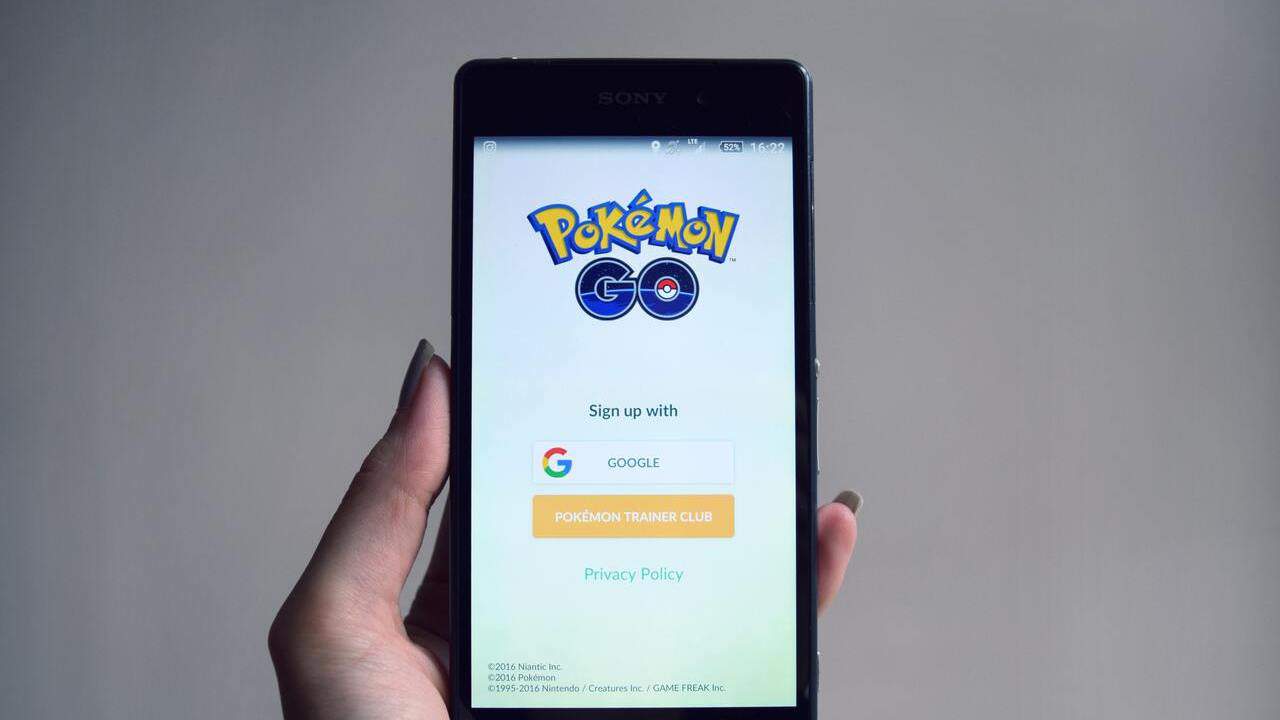 phone with the game pokemon go on the screen
