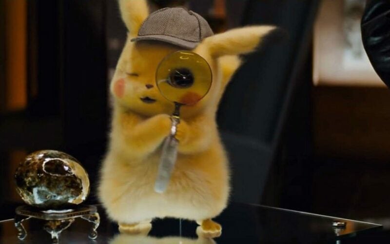 pikachu holding a magnifier