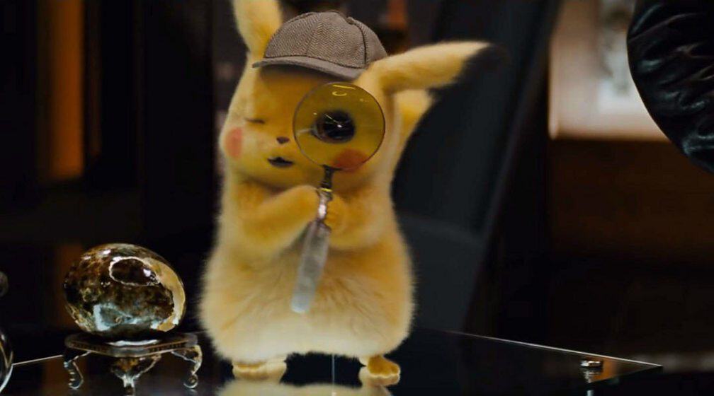 pikachu holding a magnifier