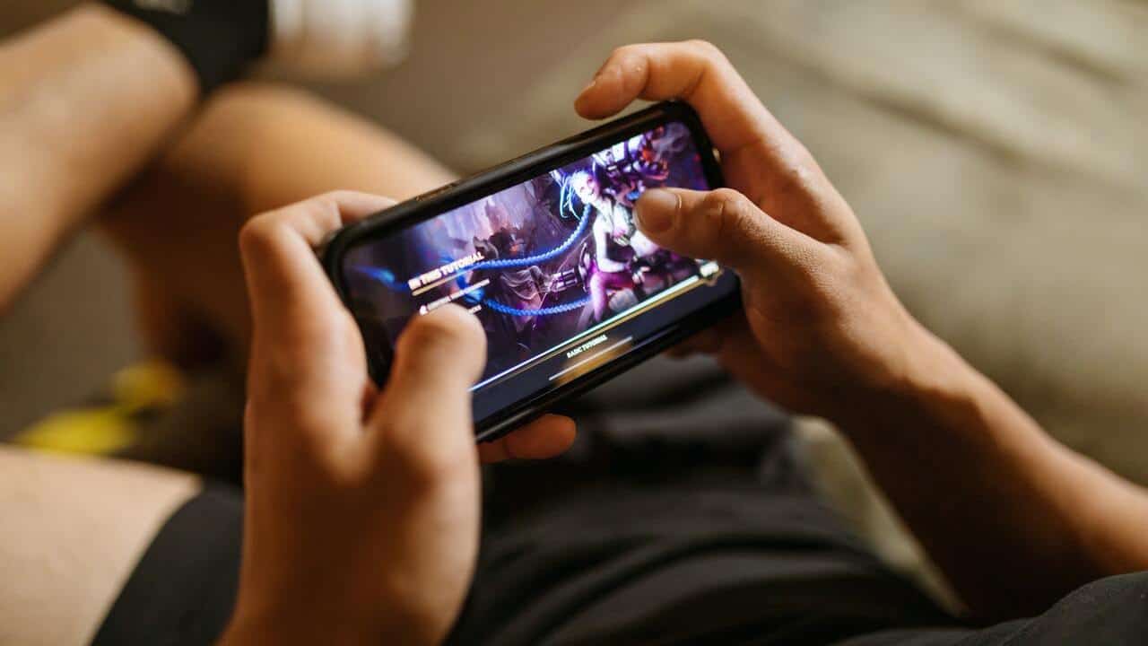 man playing a game on his phone