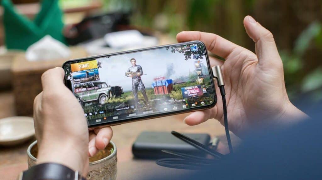 man playing a mobile game on phone