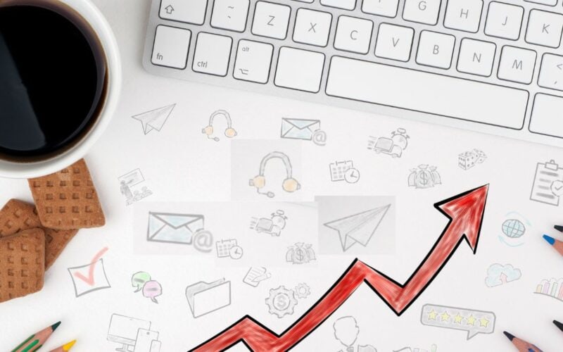 header image for the article, "How to use ad creatives effectively to increase budget efficiency" featuring a bird's-eye view of a desk.