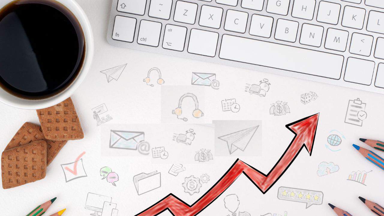 header image for the article, "How to use ad creatives effectively to increase budget efficiency" featuring a bird's-eye view of a desk.