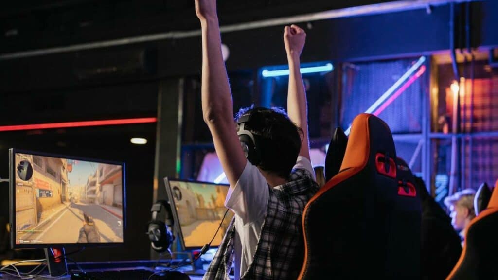 man playing a game on pc