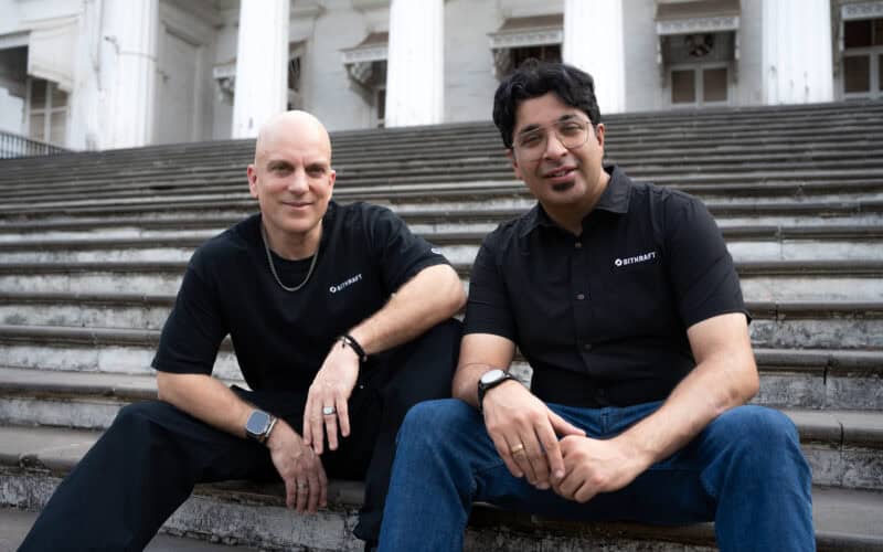 picture of Anuj Tandon and Jens Hilgers sitting on stairs