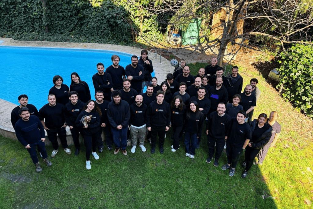 team photo of playable factory in a yard like place