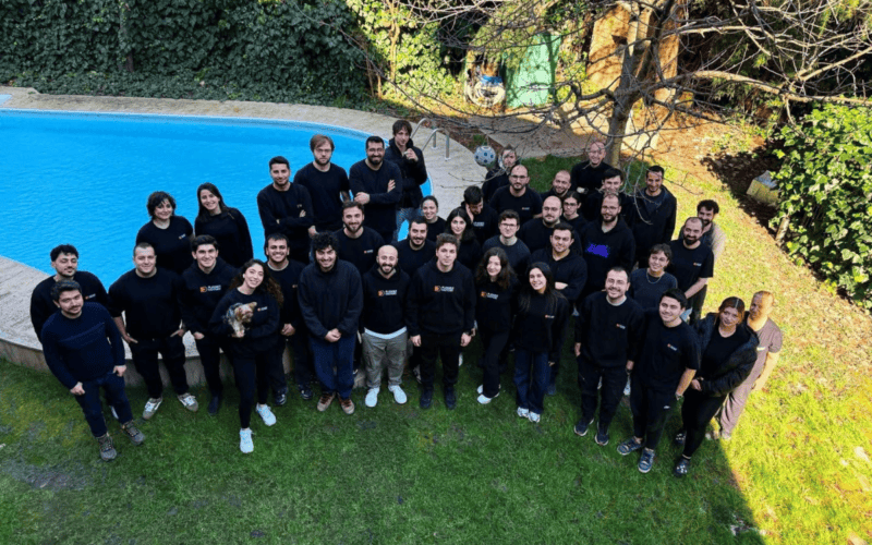 team photo of playable factory in a yard like place