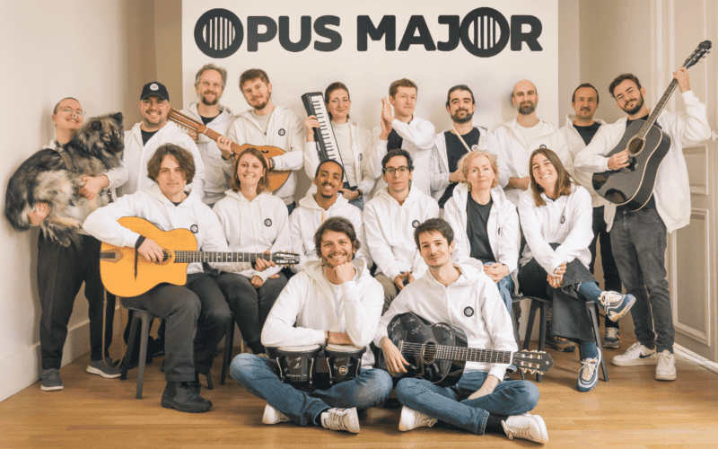 opus major team photo, around 20 people and a dog