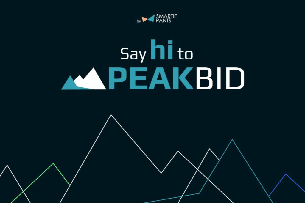 smartie pants logo on top, below that it says "say hi to PEAKBID" with peakbid logo